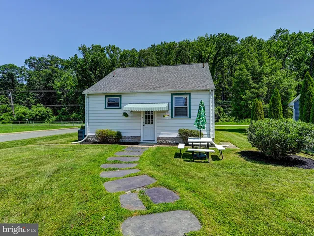 a bathroom with a vanity a sink a mirror a vanity and shower