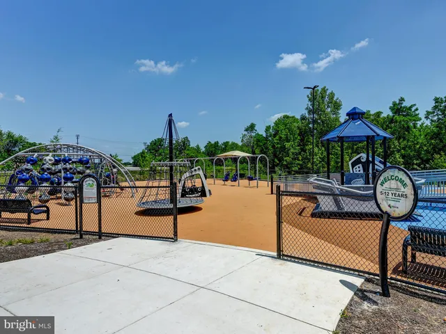 a view of a swimming pool with a patio and a garden