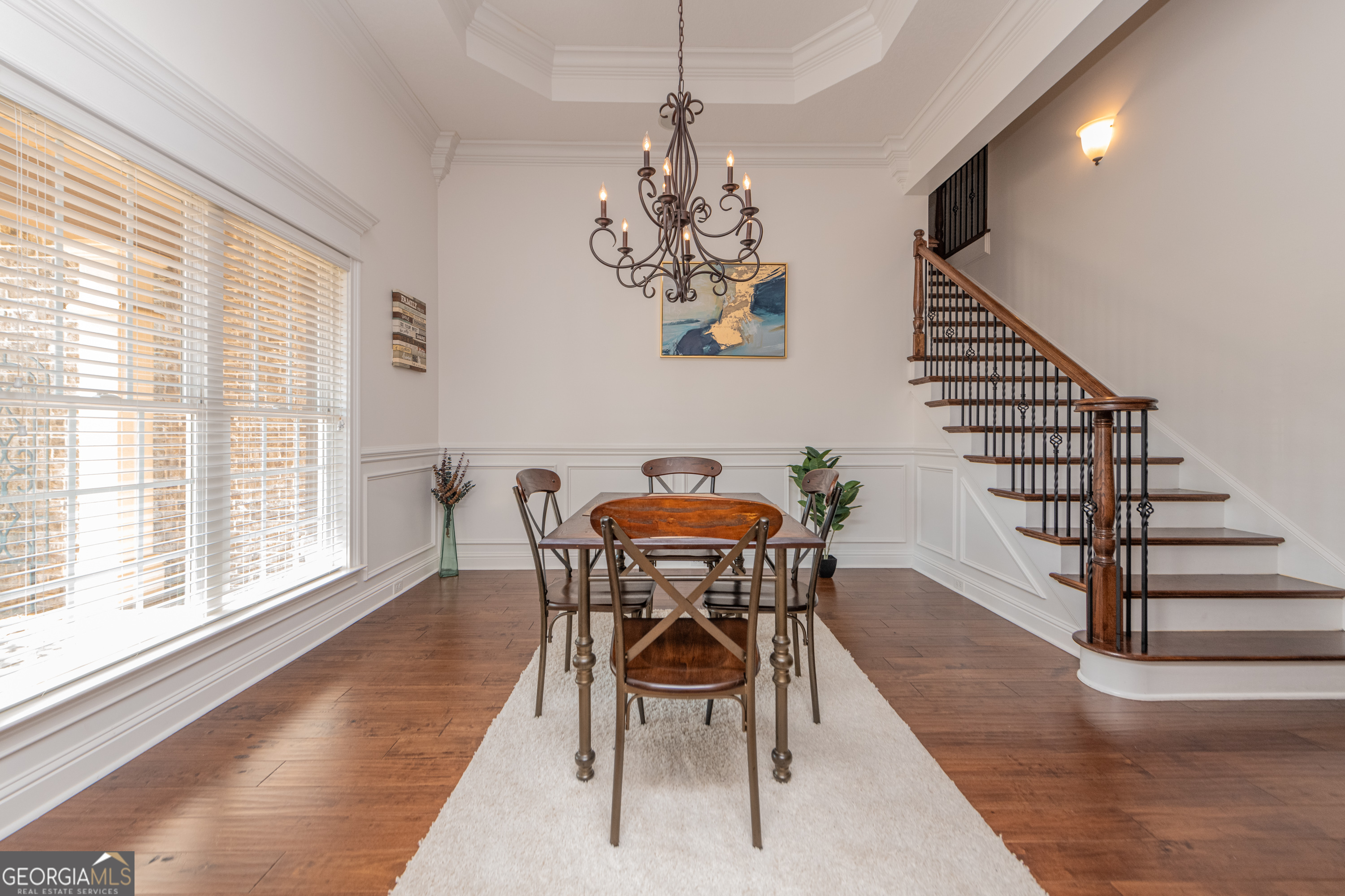 405 Old Bridge Road Warner Robins, GA 31088 - Photo 6 of 55 a view of a dining room with furniture wooden floor and a chandelier