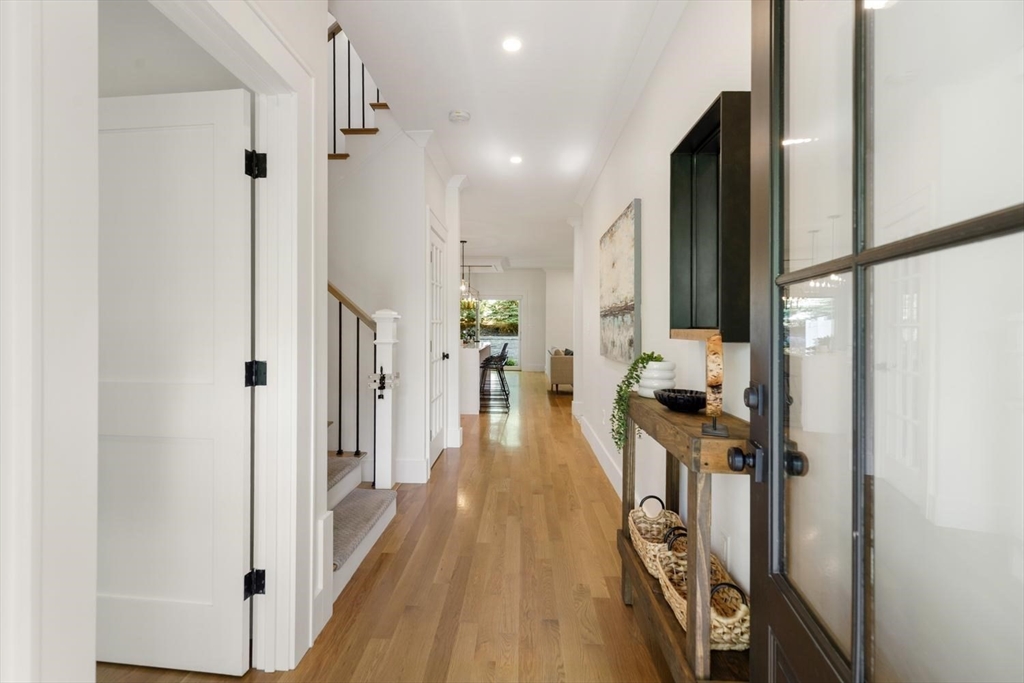 1124 Chestnut Street Newton, MA 02464 - Photo 13 of 41 a view of a hallway with wooden floor and living room