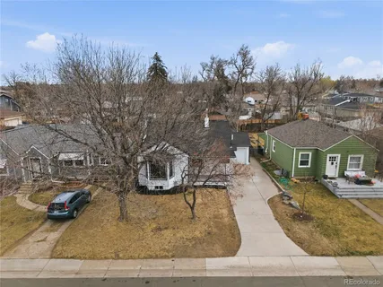 an aerial view of residential building and trees