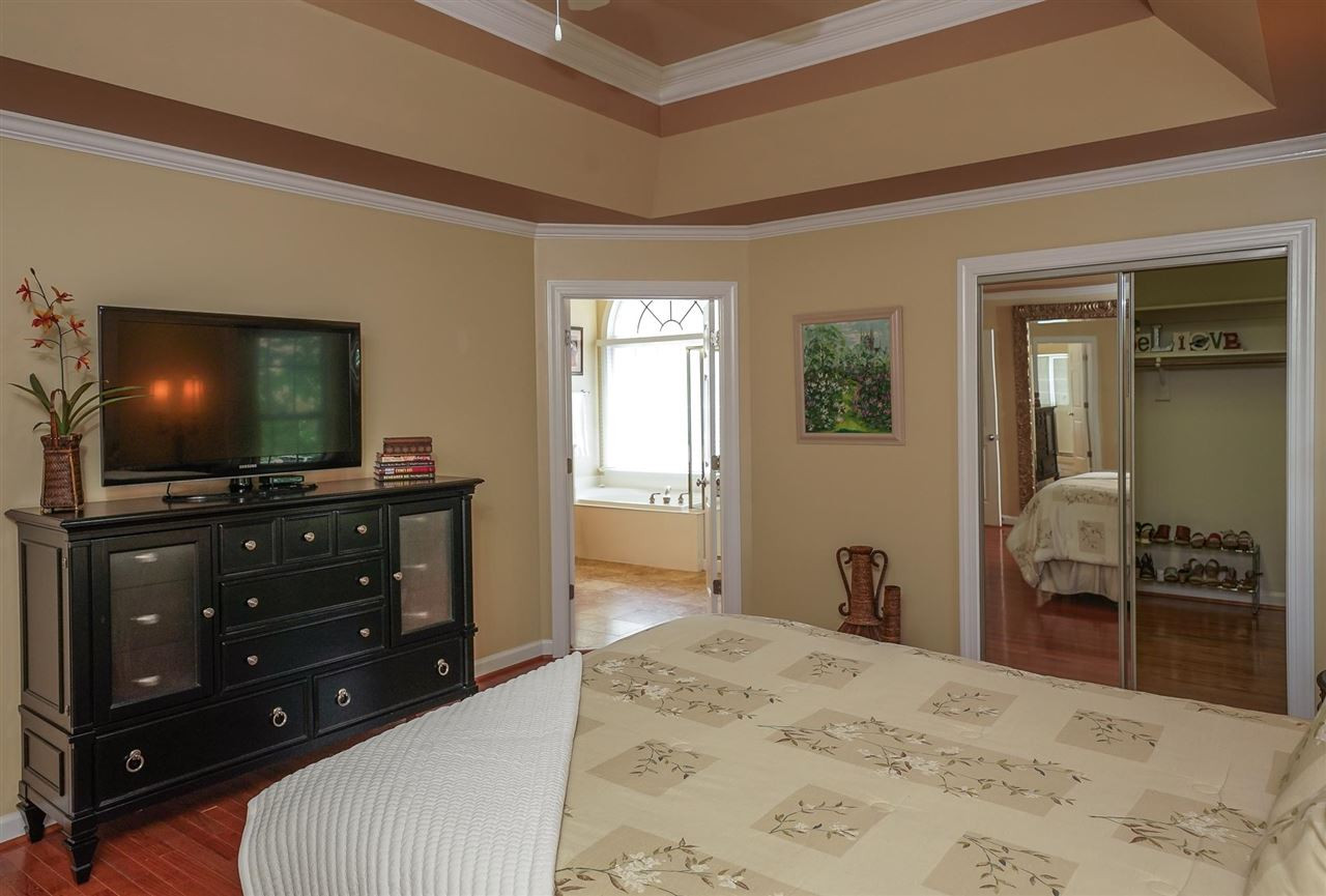 6000 Tiffield Way Wake Forest, NC 27587 - Photo 18 of 30 Large Owner's Suite with tray ceiling, hardwood floors, Large walk-in closet with mirrors on the doors. Owner's Suite