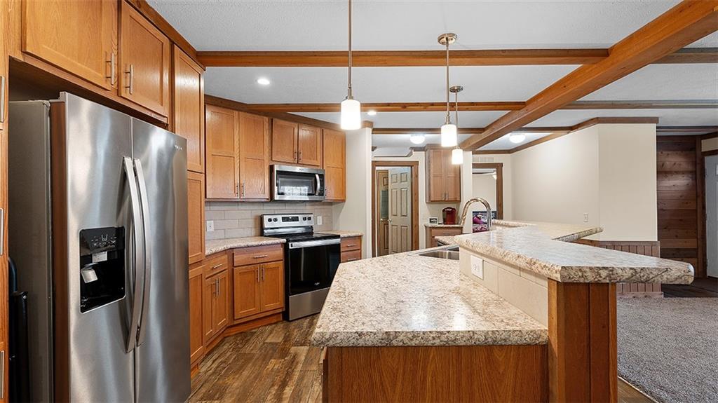 86 Eldersville Road Burgettstown, PA 15021 - Photo 11 of 50 a kitchen with stainless steel appliances granite countertop a sink a refrigerator and a stove