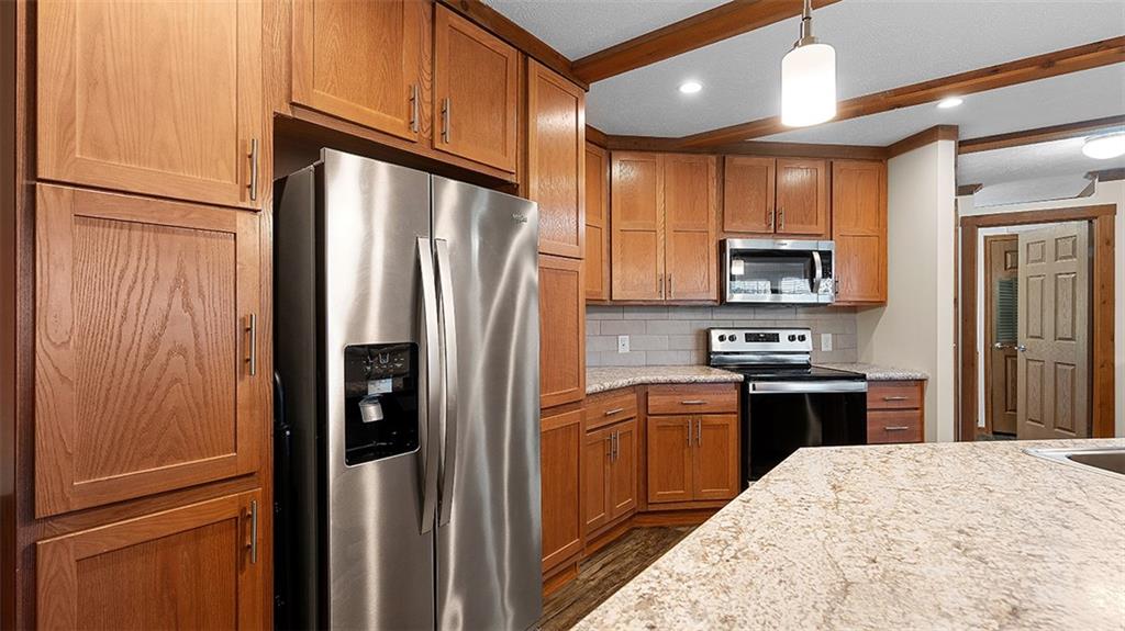 86 Eldersville Road Burgettstown, PA 15021 - Photo 13 of 50 a kitchen with stainless steel appliances granite countertop a refrigerator a stove a sink and a microwave
