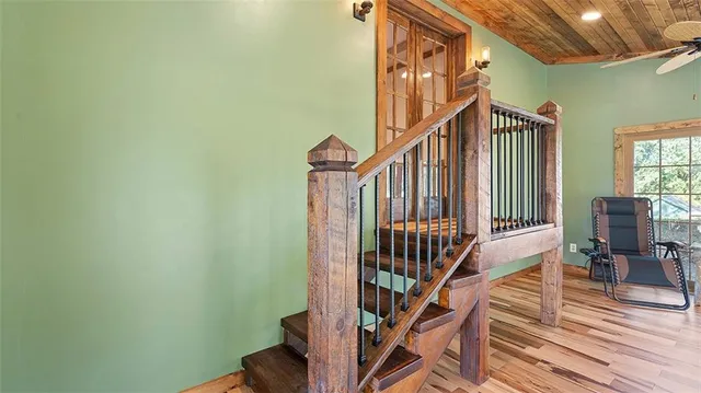 a bedroom with furniture window and wooden floor