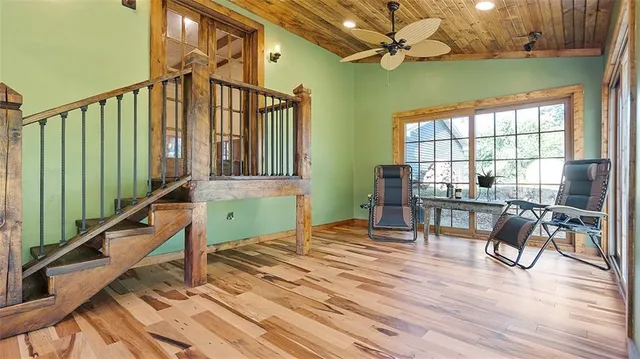a view of an entryway with wooden floor