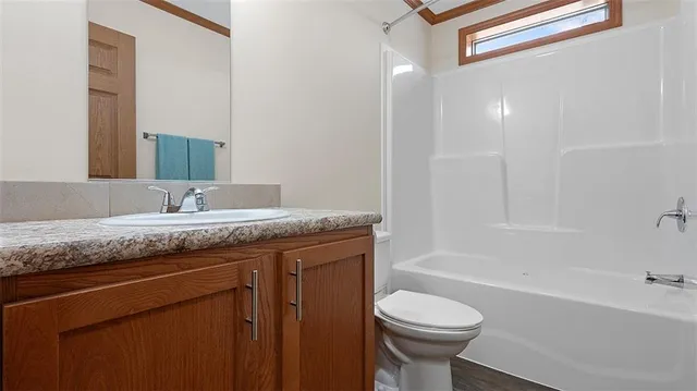 a kitchen with stainless steel appliances granite countertop a sink and a window