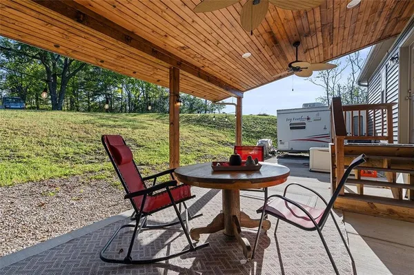 a patio with table and chairs