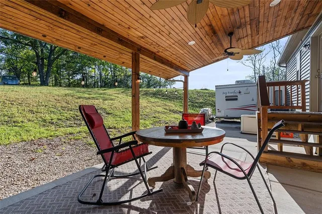 a patio with table and chairs