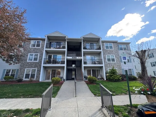 a front view of a brick house with a yard
