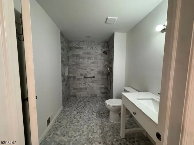 a bathroom with a sink and a toilet