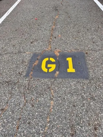 a view of a swimming pool with a table and chairs