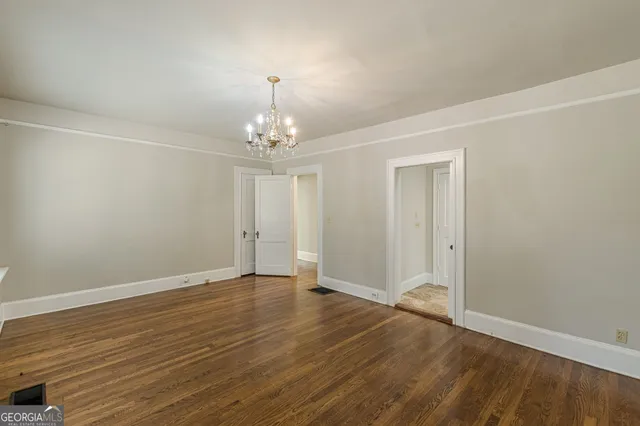 a view of room with window and hardwood floor