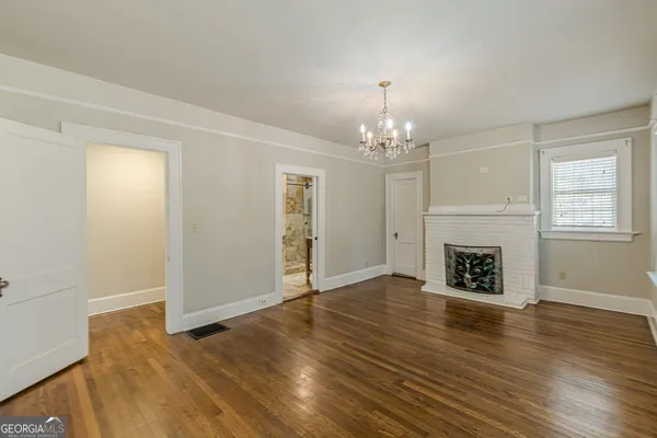 a large white kitchen with a large window