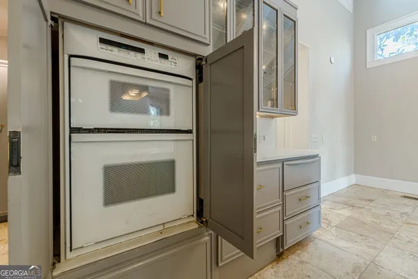 a kitchen with a stove a sink and a refrigerator