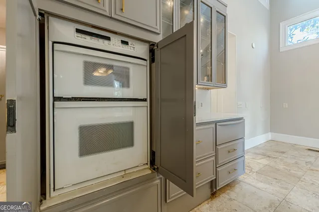 a kitchen with a stove a sink and a refrigerator