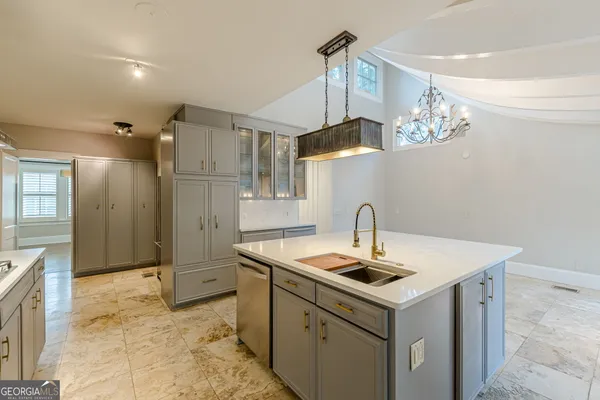 a view of a livingroom with wooden floor and a fireplace
