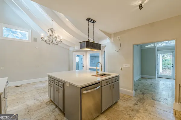 a kitchen with stainless steel appliances granite countertop a stove and a sink