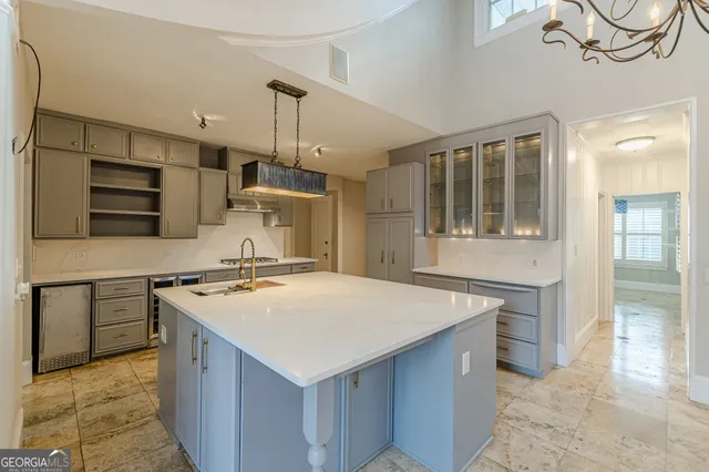 a kitchen with stainless steel appliances granite countertop a stove and a refrigerator
