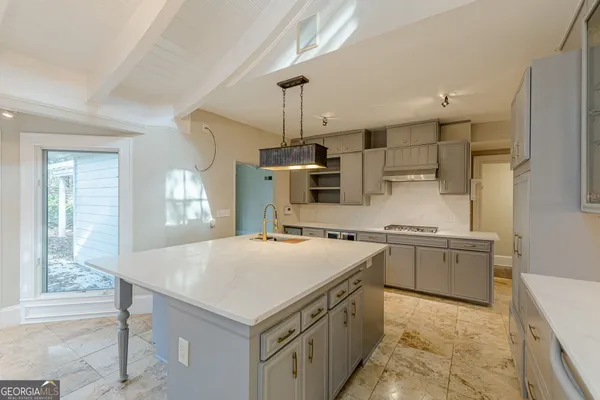 a kitchen with a stove and a sink