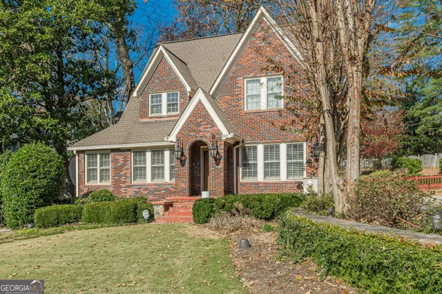front view of a house next to a yard
