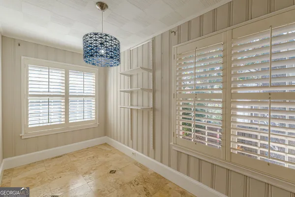 a view of walk in closet with empty room