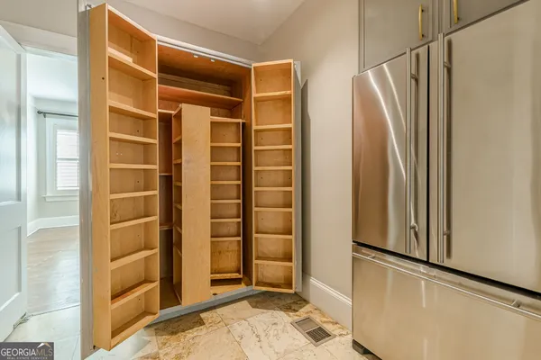 a room with furniture and a mirror