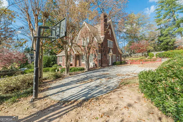 a view of a brick house with a large window