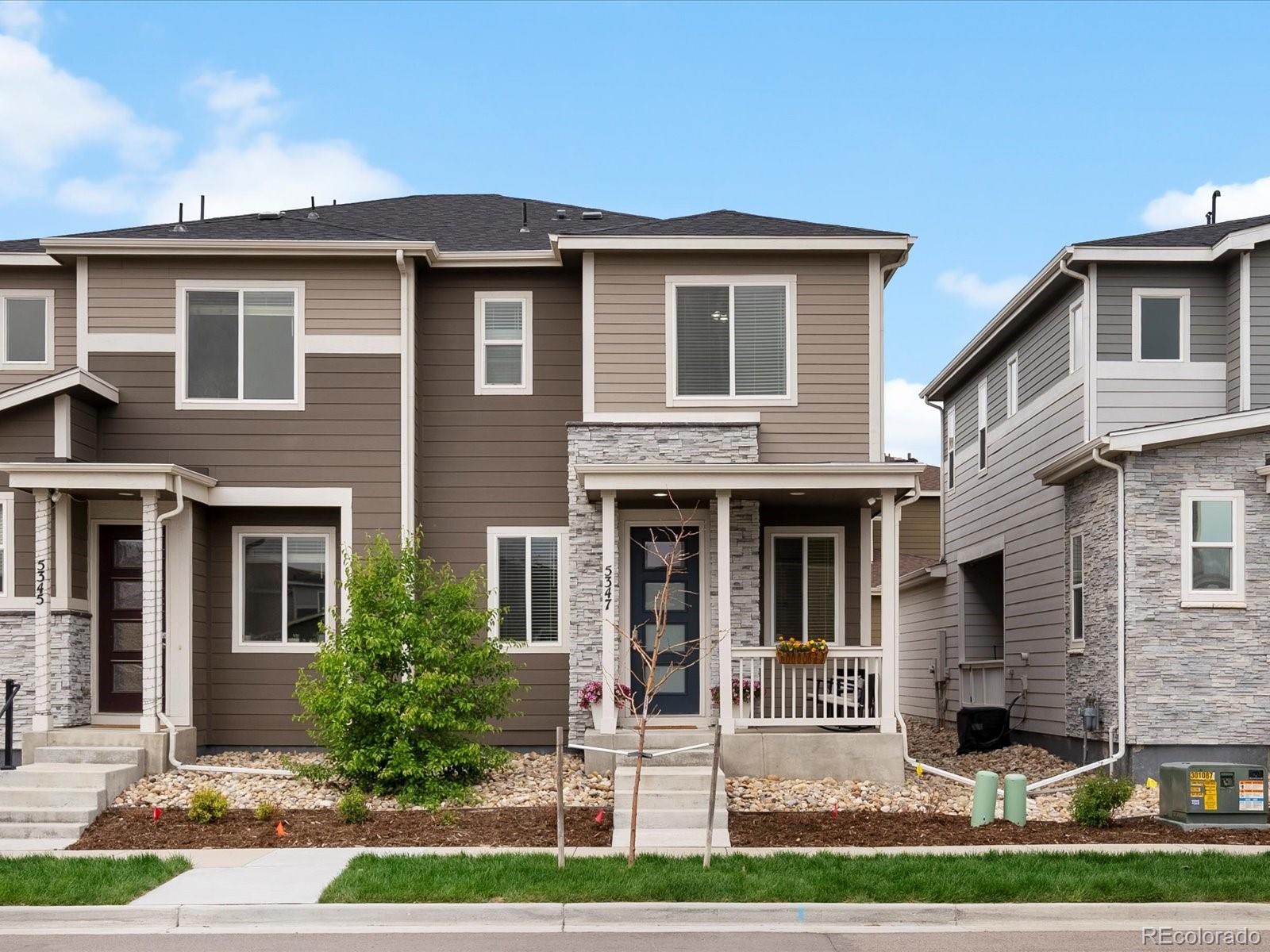 5347 Warrior Street Frederick, CO 80504 - Photo 2 of 48 a front view of a house with a yard