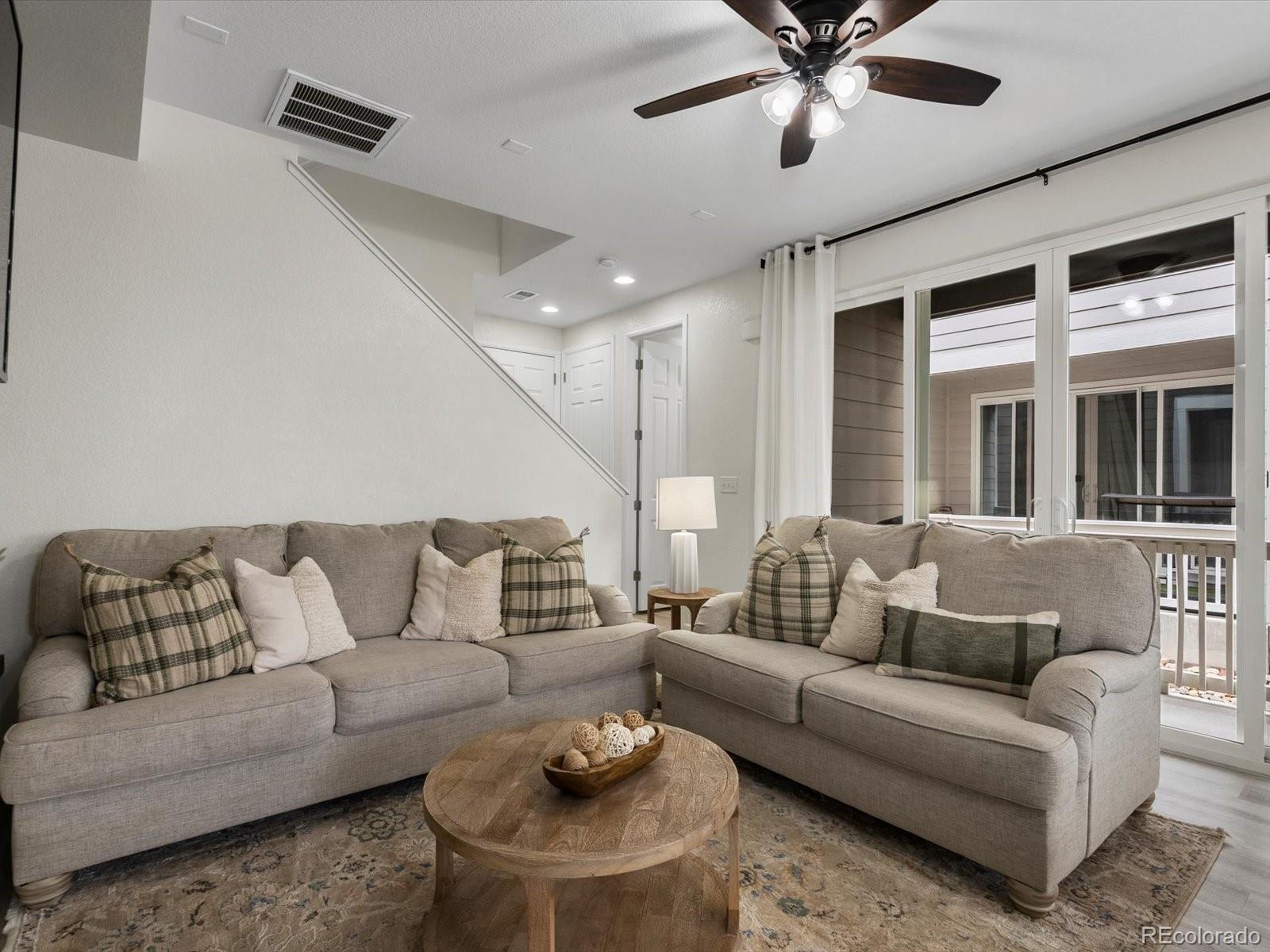 5347 Warrior Street Frederick, CO 80504 - Photo 22 of 48 a living room with furniture and a large window