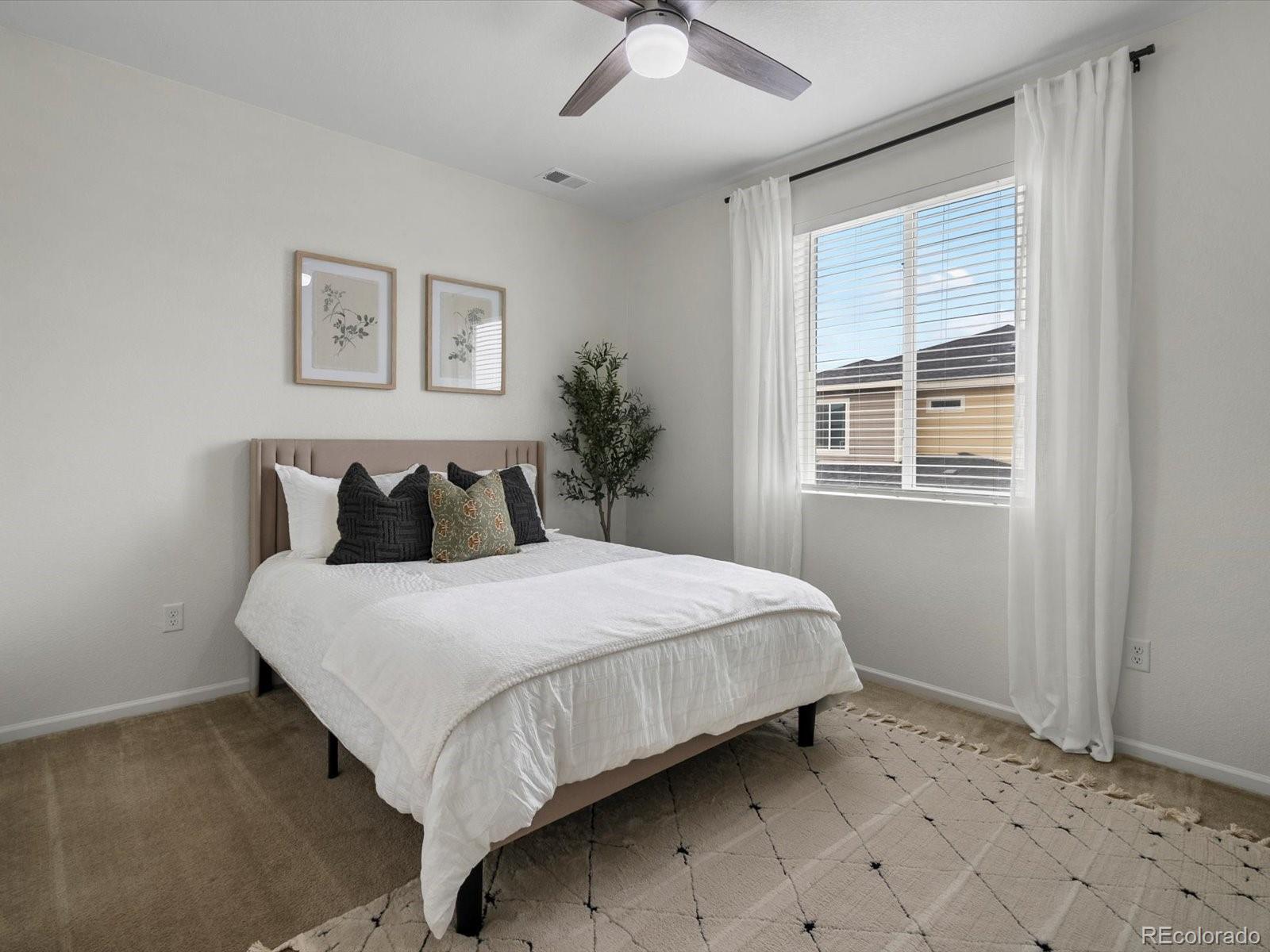 5347 Warrior Street Frederick, CO 80504 - Photo 30 of 48 a bedroom with bed and window