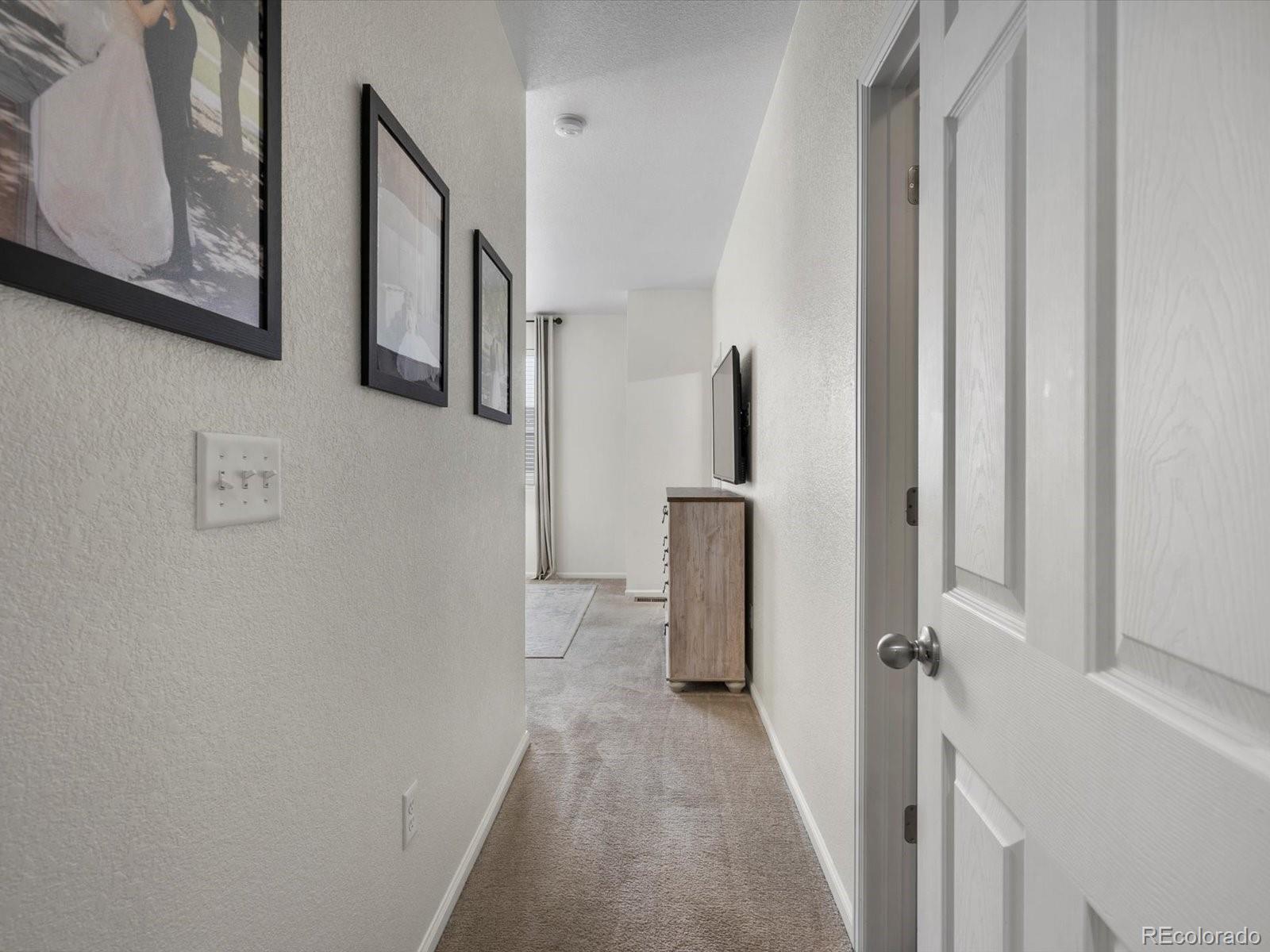 5347 Warrior Street Frederick, CO 80504 - Photo 37 of 48 a view of a hallway with front door