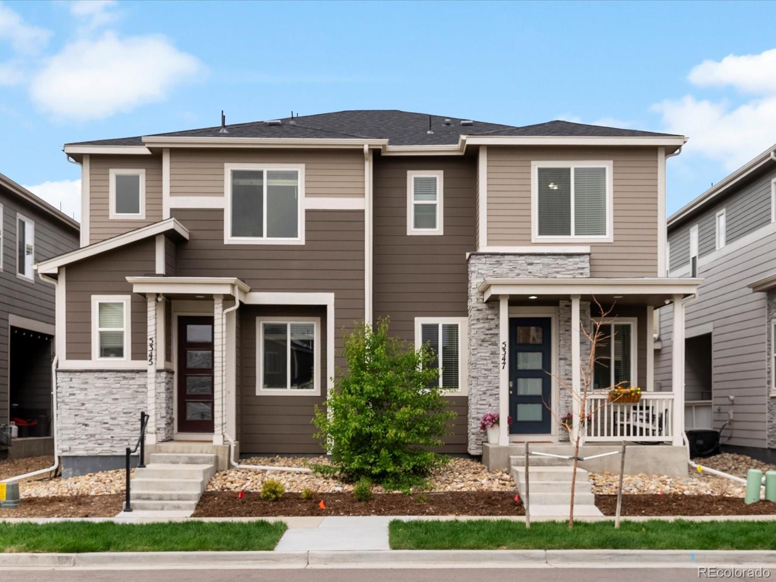5347 Warrior Street Frederick, CO 80504 - Photo 4 of 48 a front view of a house with garden