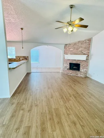 a view of a kitchen with a stove cabinets and a wooden floor