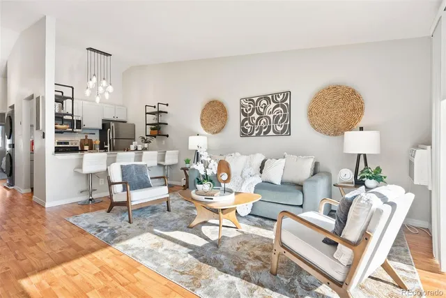 a living room with couches rug and a lamp with rug