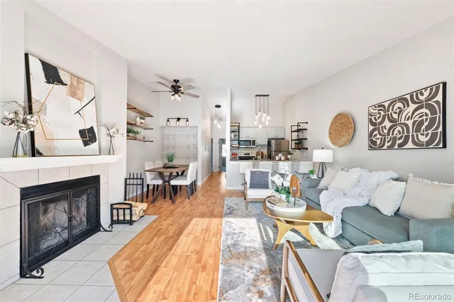 a living room with furniture and a fireplace