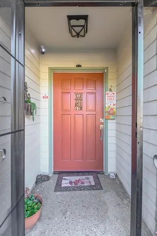 a kitchen with a refrigerator and a sink