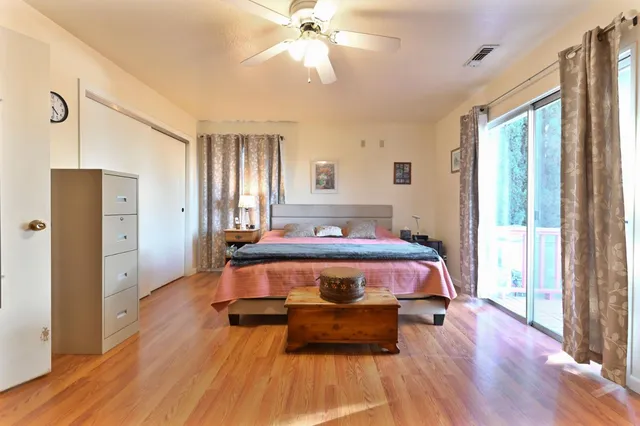 a view of a patio with wooden floor