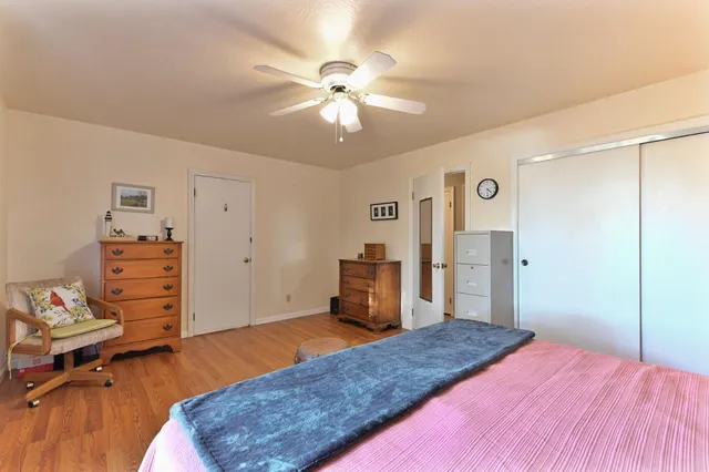 a view of a balcony with floor to ceiling windows with wooden floor