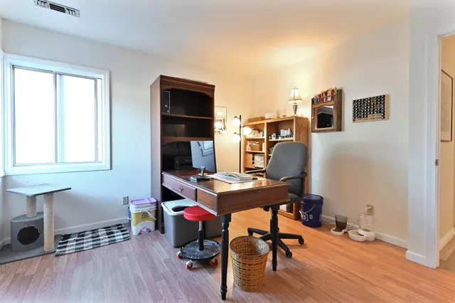 a view of a patio with table and chairs and potted plants