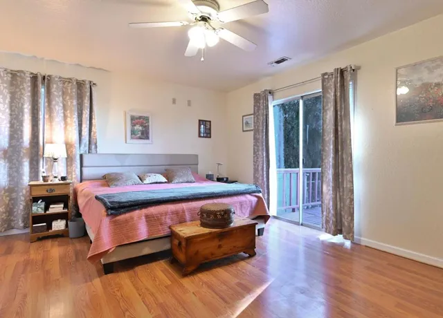 a bed room with a bed and a window