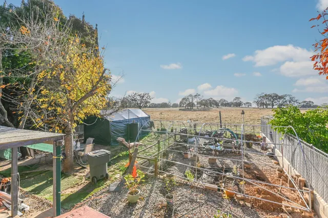 a view of a livingroom with furniture and a flat screen tv