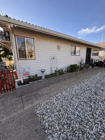 a view of a room with gym equipment and windows