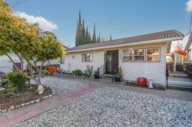 a front view of a house with garden