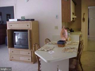 0 Edward Taylor Road, Unit 60 Ocean City, MD 21842 - Photo 1 of 4 a kitchen with a sink a stove and a refrigerator