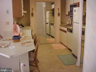 0 Edward Taylor Road, Unit 60 Ocean City, MD 21842 - Photo 2 of 4 a bathroom with a sink and a mirror