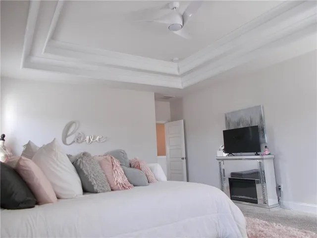 a bedroom with a bed and a mirror