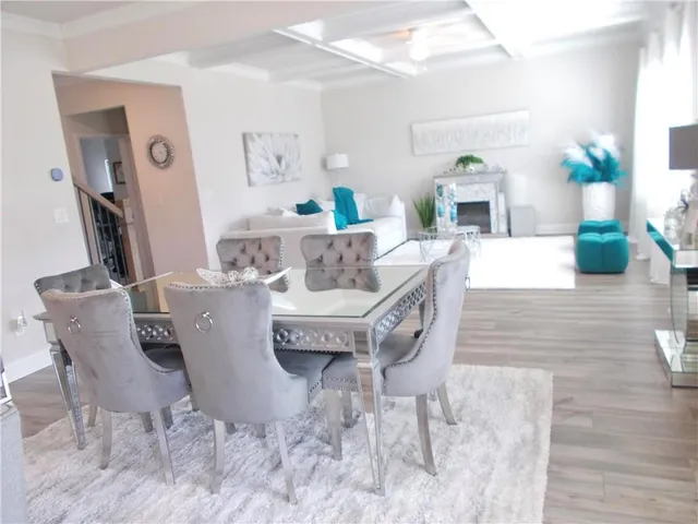 a living room with furniture and a table