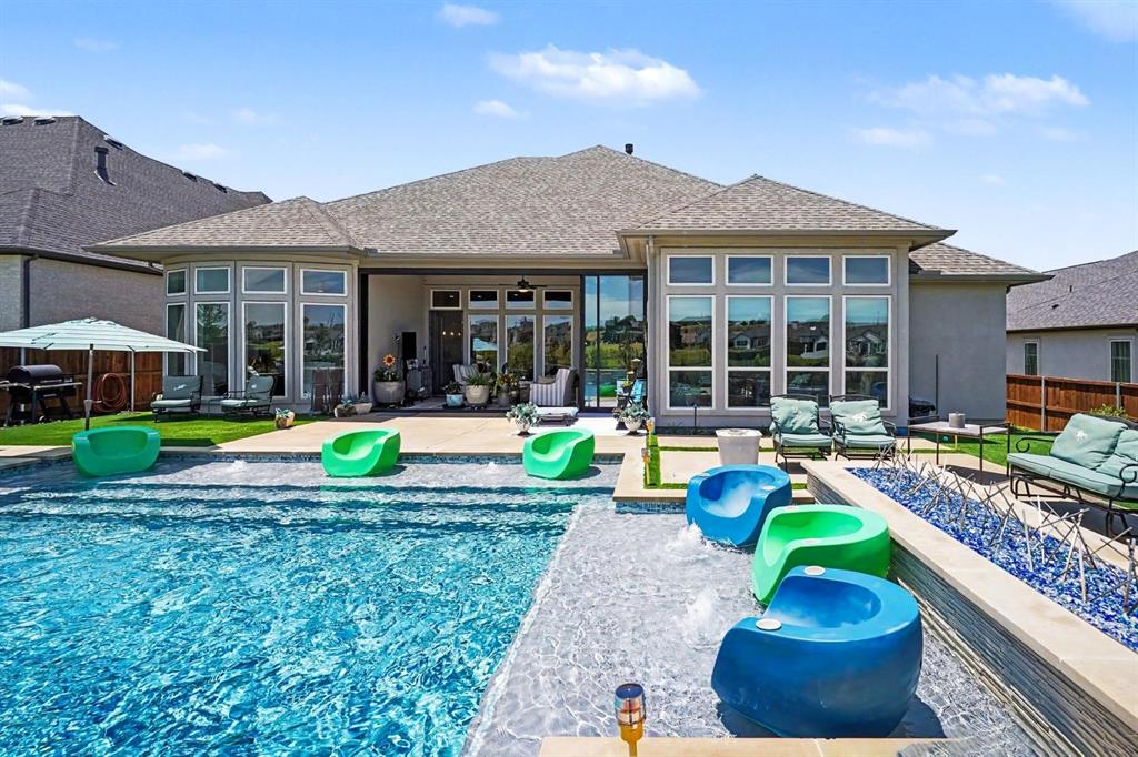 573 Broadleaf Way Haslet, TX 76052 - Photo 6 of 35 a view of a house with a yard patio and swimming pool