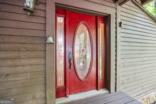 a kitchen with granite countertop a sink stove top oven and cabinets